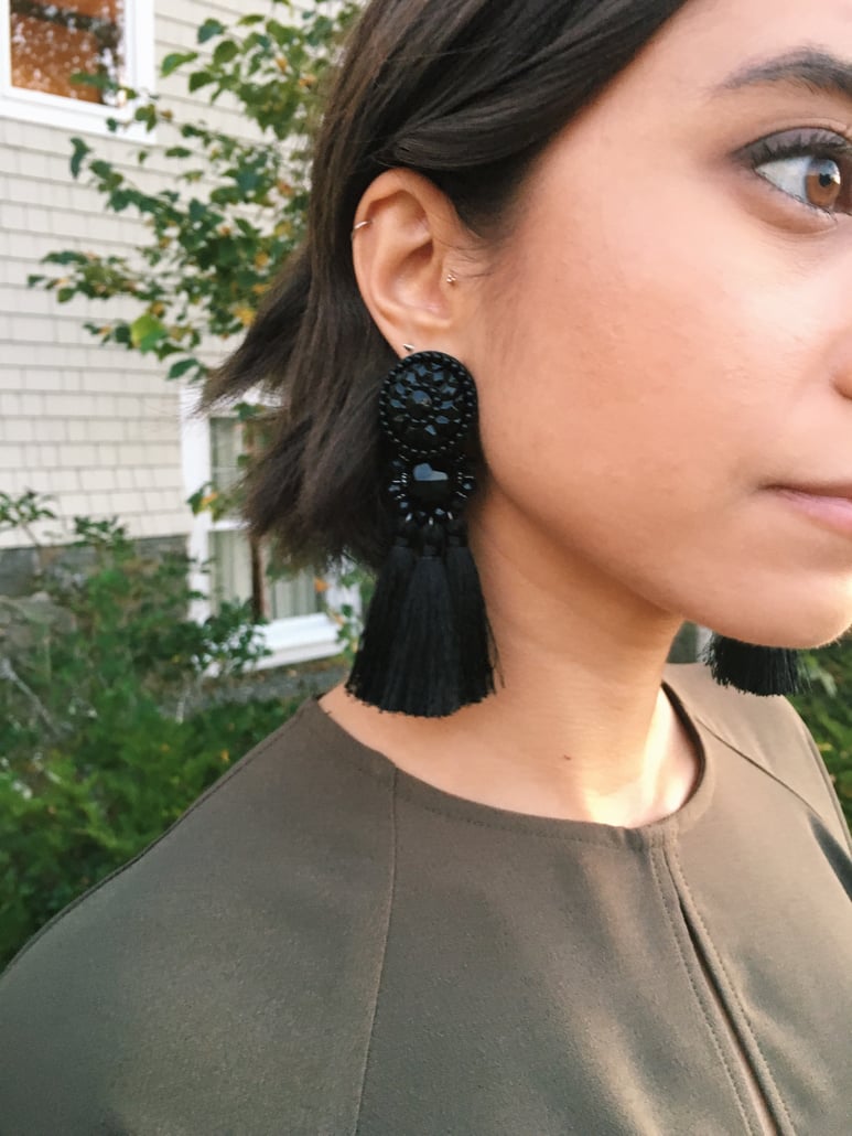 Wedding rehearsal dinner guest outfit in New England in autumn featuring Topshop dress, leather jacket, fringe earrings