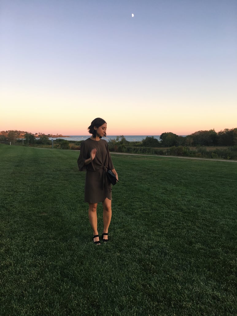 Wedding rehearsal dinner guest outfit in New England in autumn featuring Topshop dress, leather jacket, fringe earrings